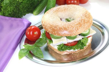 Bagel with Camembert cheese clipart