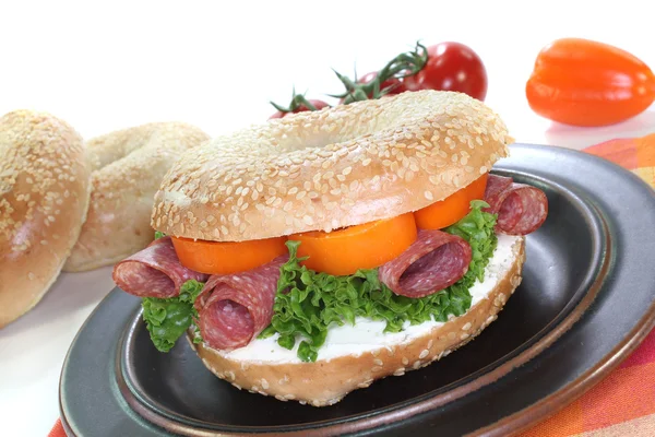 Bagel with salami — Stock Photo, Image