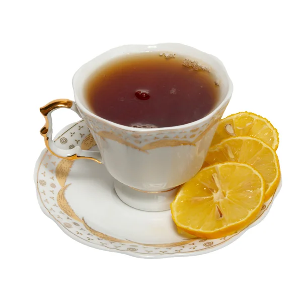 ถ้วยชาพร้อมชาและมะนาวแยกจากสีขาว . — ภาพถ่ายสต็อก