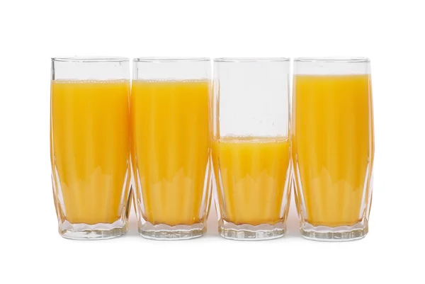 Four glasses with orange juice — Stock Photo, Image