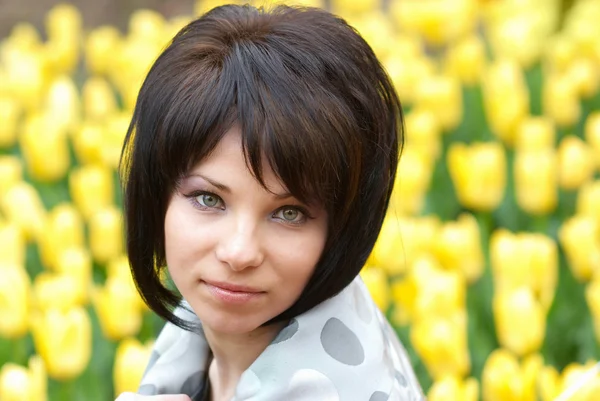 Pretty girl with tulips — Stock Photo, Image