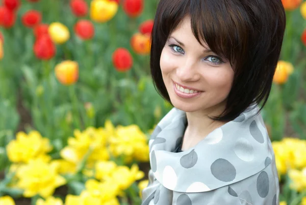 Pretty girl with tulips — Stock Photo, Image