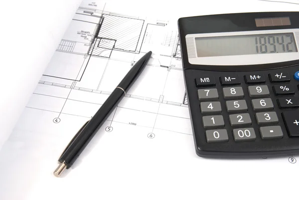 Calculator and pen on the drawing — Stock Photo, Image