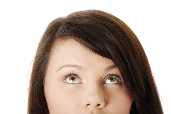 Young girl with her eyes looking up — Stock Photo, Image