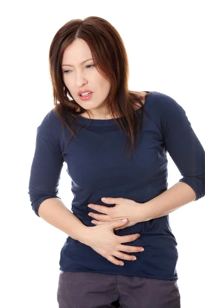 Kobieta trzyma jej żołądek — Zdjęcie stockowe