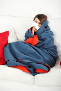 Young woman at home having flu. clipart