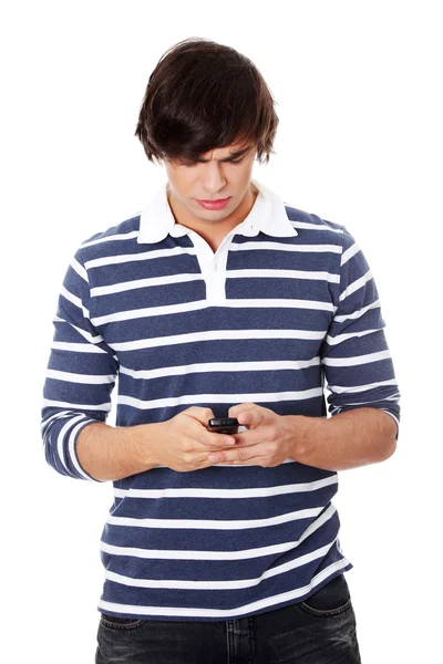 A handsome happy man using mobile phone. — Stock Photo, Image