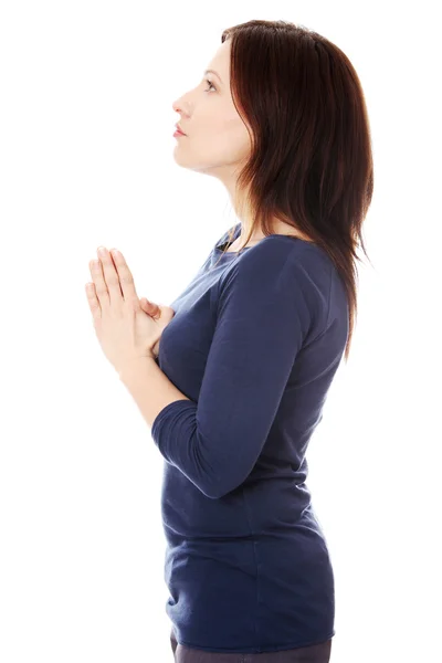 Średniej wieku kobieta modli się — Zdjęcie stockowe