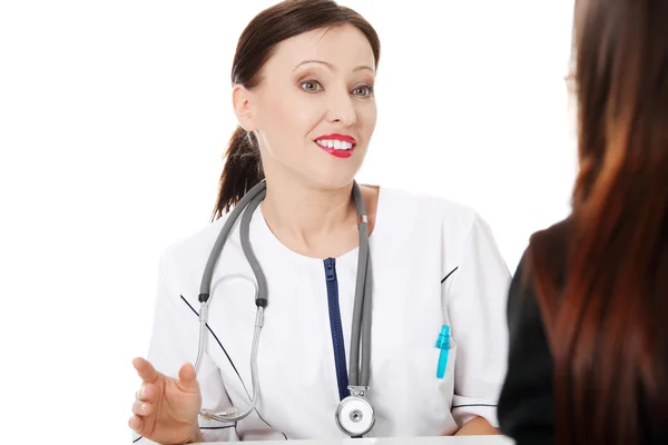 Mature doctor with her patient. — Stock Photo, Image