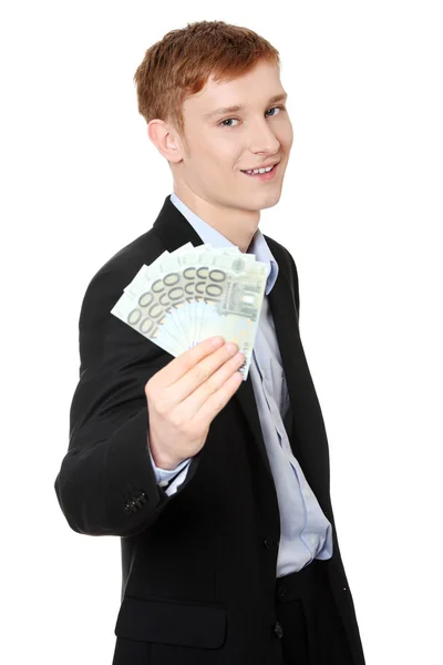 Young handsome businessman holding euros — Stock Photo, Image