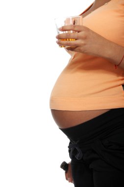 Pregnant woman holding glass full of alcohol clipart