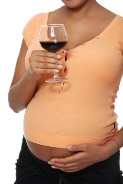 Pregnant woman holding glass full of alcohol clipart