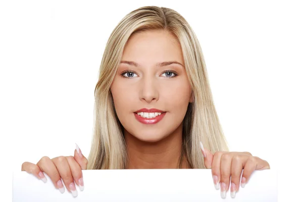 Young woman holding a blank signboard. — Stock Photo, Image