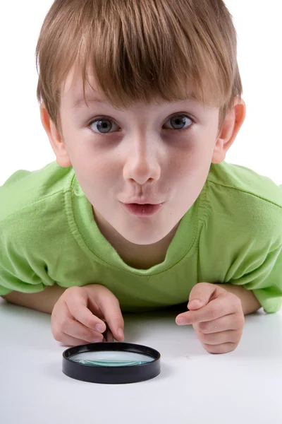 Boy with magnifying glass — Stock Photo, Image