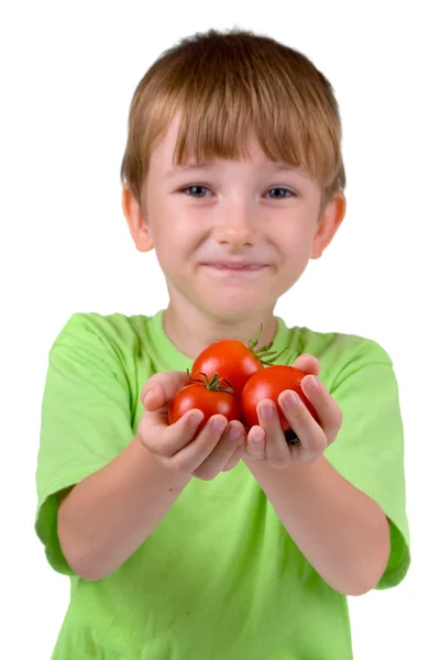 Niño con tomates — Foto de Stock