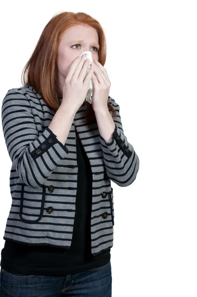 Donna soffiando il suo naso — Foto Stock