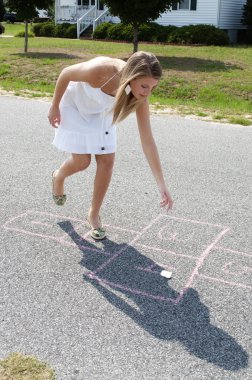 Woman Playing Hopscotch clipart