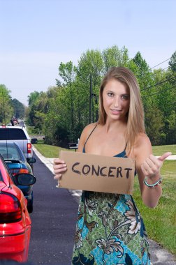 Woman Hitch Hiking to a Concert clipart