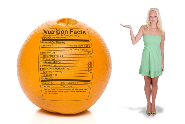 Žena s oranžovou výživa fakta — Stock fotografie