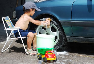 Playing around the car and cleaning, children in summertime clipart