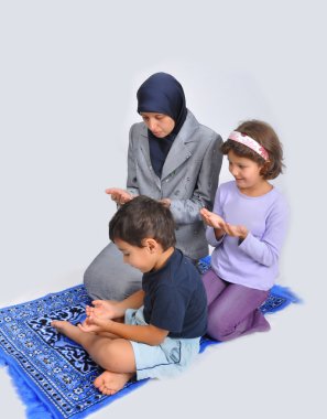 Muslim mother with children learning them clipart