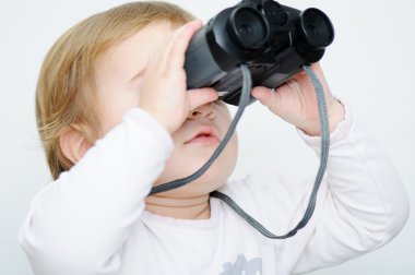 Baby with binoculars, closeup clipart