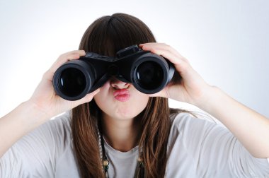 Angry female with a binoculars clipart