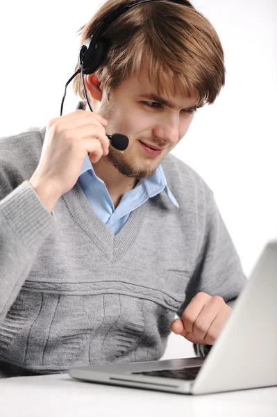 Closeup of a businessman with headset working on laptop, support service — Stock Photo, Image