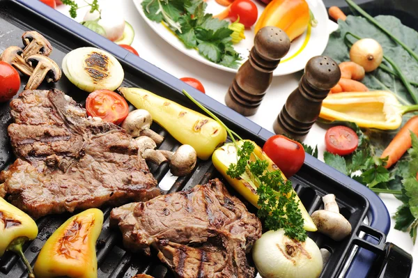 Barbecue, prepared beef meat and different vegetables and mushrooms on gril — Stock Photo, Image