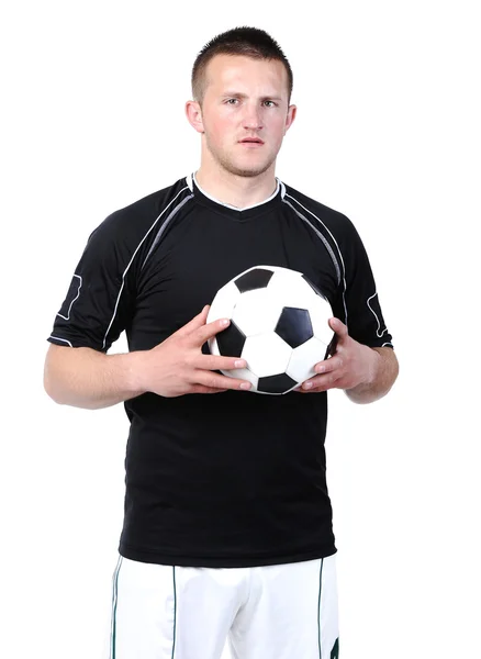 Piłkarz trzyma piłkę na białym tle — Zdjęcie stockowe