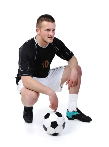 Ποδοσφαιριστής κρατά μπάλα που απομονώνονται σε λευκό — Φωτογραφία Αρχείου