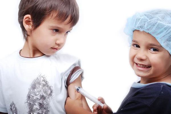 Two kids playing doctors — Stock Photo, Image