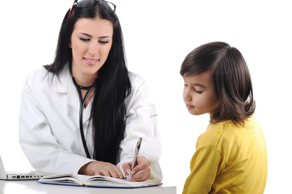 Young female doctor examining little cute child at modern hospital — Stock Photo, Image