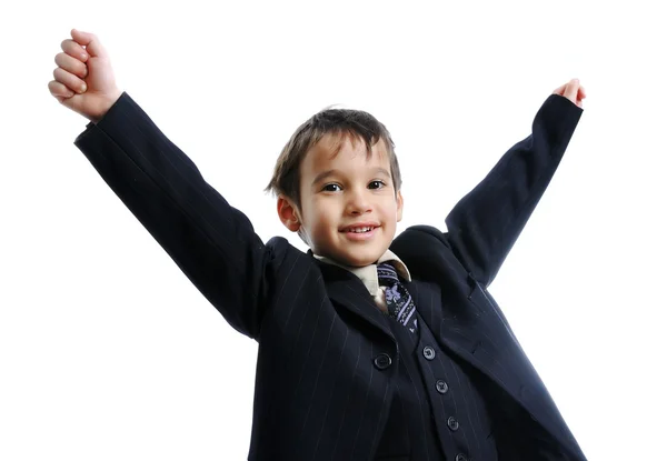 Pequeno garoto bonito, vestindo um terno de negócios com um empate, comemorando uma vitória, suc — Fotografia de Stock