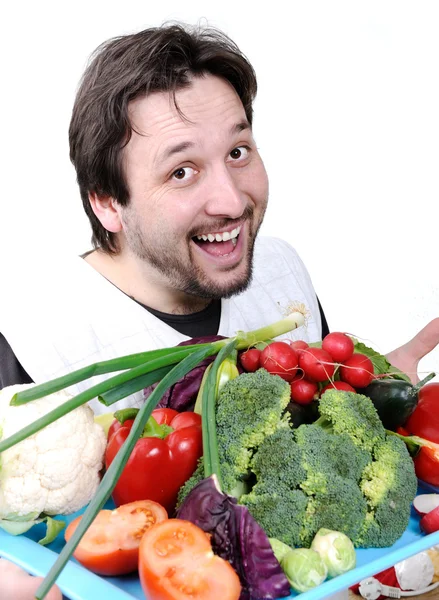 Hombre con muchas verduras diferentes — Foto de Stock