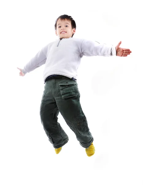 stock image Adorable child jumping a over white background