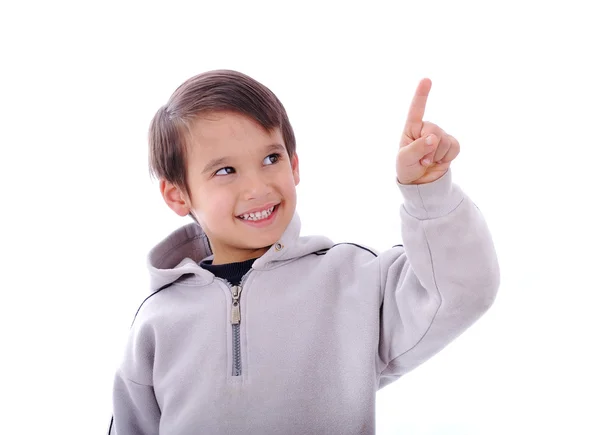 Το αγόρι να χαμογελάει και να δείχνει ένα δάχτυλο επάνω, αντίγραφο-διάστημα — Φωτογραφία Αρχείου