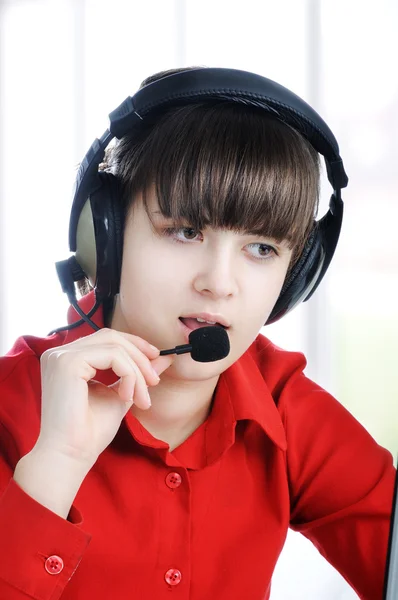 Beautiful Customer Representative with headset smiling during a telephone c — Stock Photo, Image