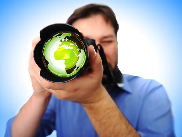 Man with camera shooting earth — Stock Photo, Image