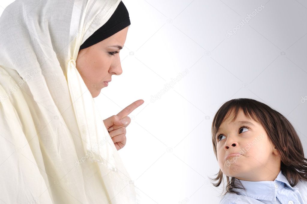 Muslim mother threating her son Stock Photo by ©zurijeta 6150473