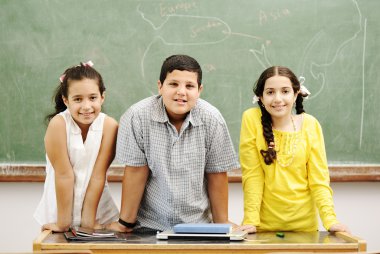 Three children in classroom clipart