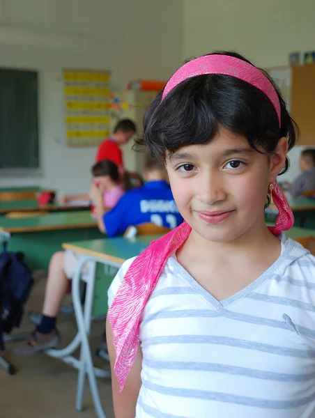 Cute girl in classroom — Stock Photo, Image