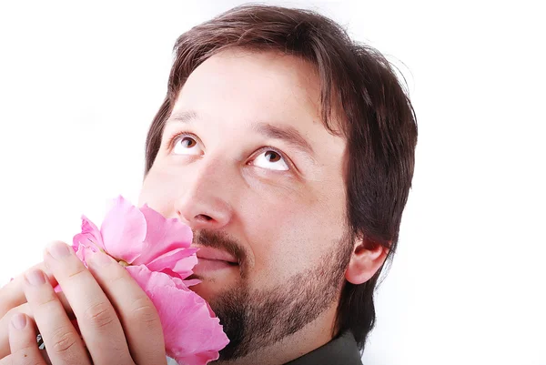 Sevimli adam smeling pembe güller — Stok fotoğraf