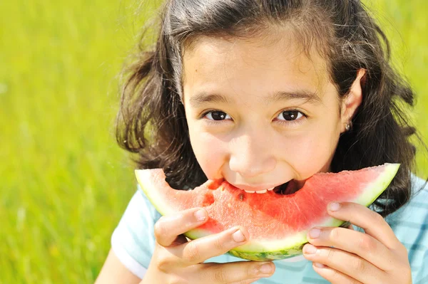 Eating watermelon outside — Stock Photo, Image