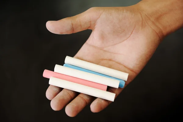 Chalks in hand — Stock Photo, Image