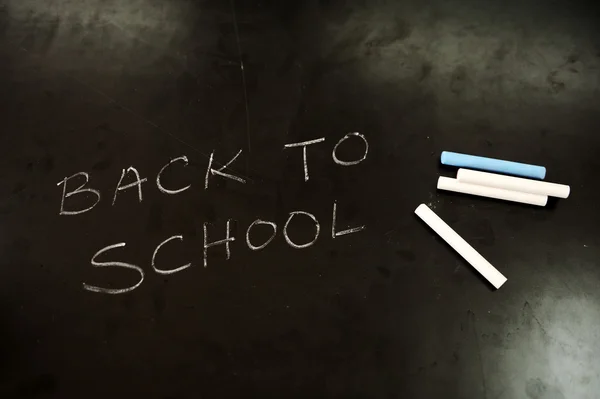Blackboard and chalks: BACK TO SCHOOL — Stock Photo, Image
