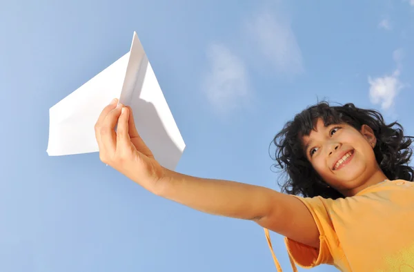 stock image Little cute girl holding an airplane