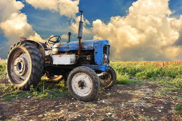 Very old tractor in field, different parts - no trademark at all — Stock Photo, Image