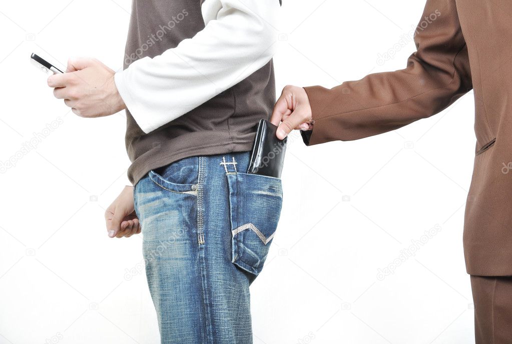 The male hand pulls out a purse from a pocket of the man.