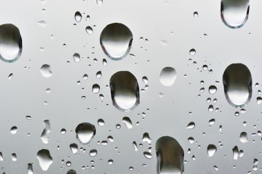 Natural big water drops on window glass clipart